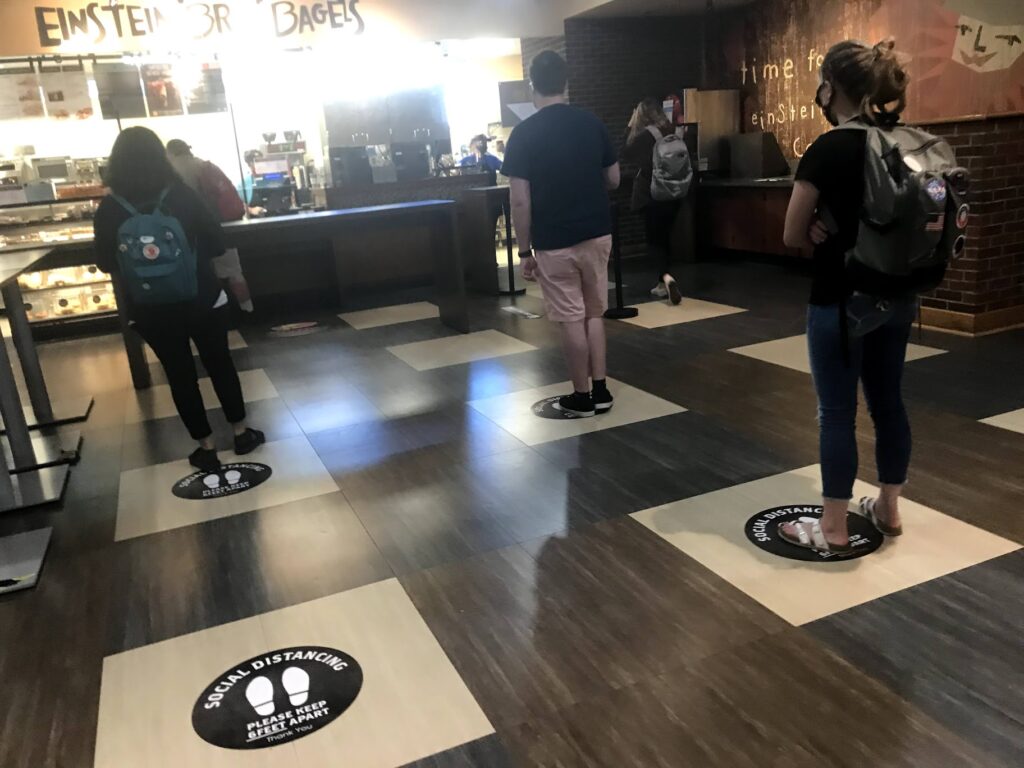 the line at my university's einstein bagel with places to stand that were multiple feet apart